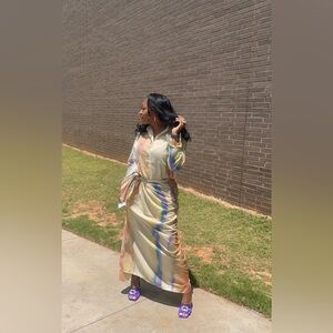 Gorgeous 2 piece set top is a button down with wrap around skirt